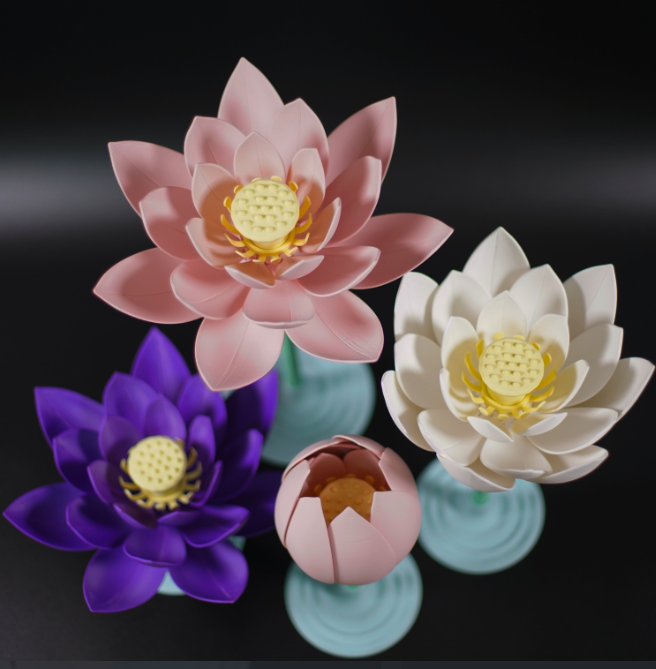  3D print idea for wife featuring delicate lotus flowers in pastel colors, including pink, white, and purple, with intricate petals and a yellow center. This beautiful 3D print for wife is ideal as a decorative piece for home decor.
