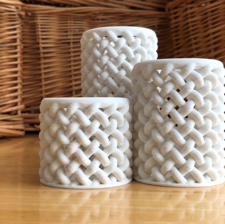 unique 3d printed floral containers featuring elegant braided design.
