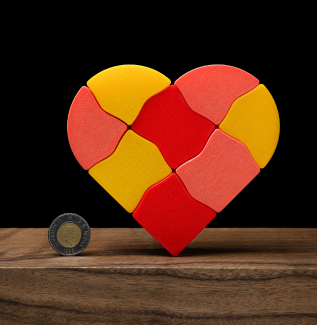 Heart-shaped 3D-printed snap boxes in red, yellow, and orange, made from interlocking pieces. These playful, romantic storage boxes are a perfect thing to 3D print for wife to hold small items or tokens of love.
