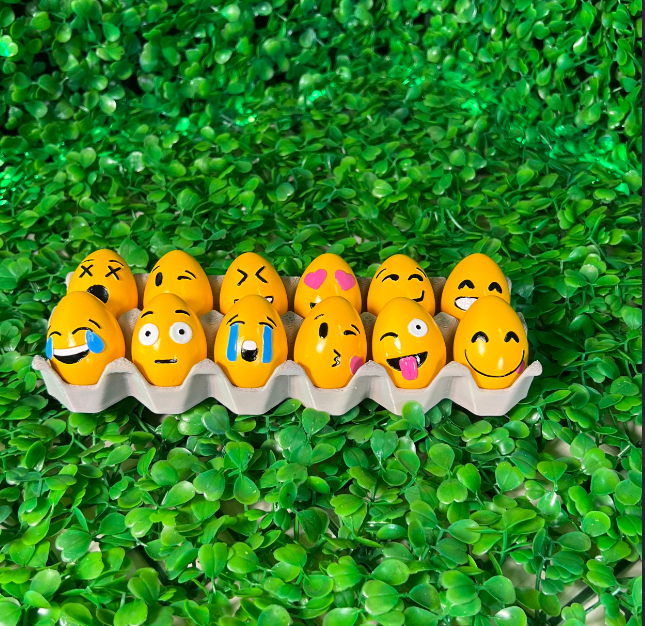 A set of 3D-printed Easter eggs with customizable emoji designs, perfect for seasonal decoration.