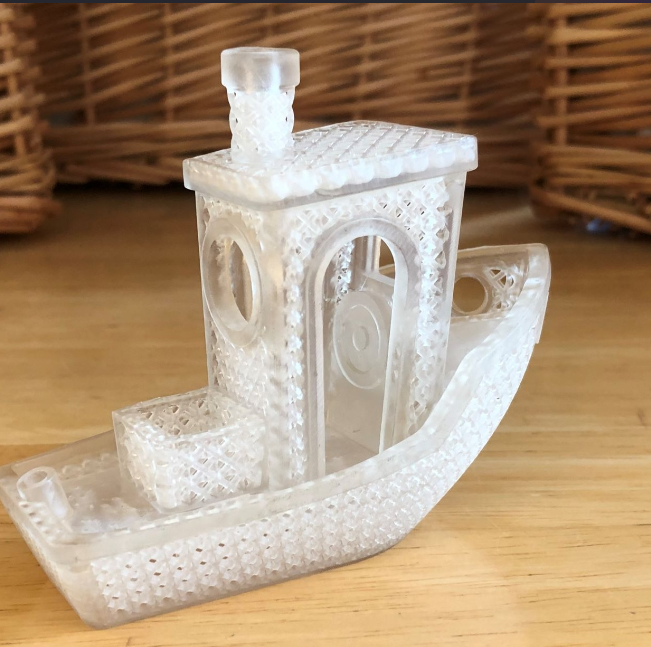 A creative 3D-printed version of the classic Benchy with an intricate lattice design.
