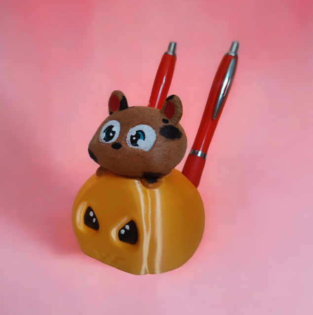 A charming 3D-printed pen holder shaped like a cute hamster, designed for desk organization.
