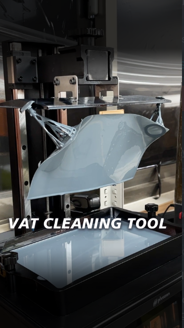 3D-printed cleaning tool for resin vats, displayed in use on a resin printer, ideal for maintaining resin printers with minimal waste.