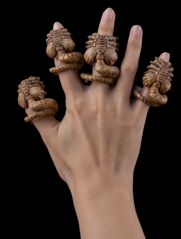 Set of alien-inspired finger extensions resembling facehuggers, perfect for cosplay or horror-themed costumes.