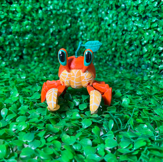 3D-printed figure of a cute orange crab.