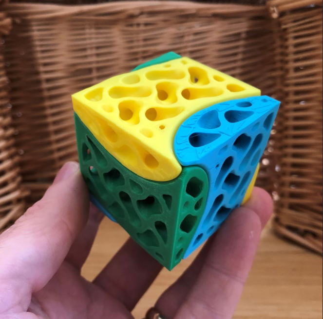 A fun 3D printed Triple Twist Cubes with vibrant colors.