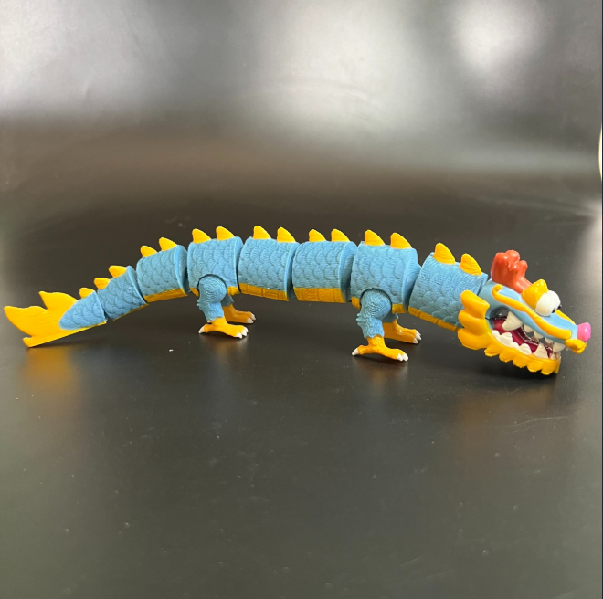 A funny 3D-printed model of a fat dragon with an articulated body.