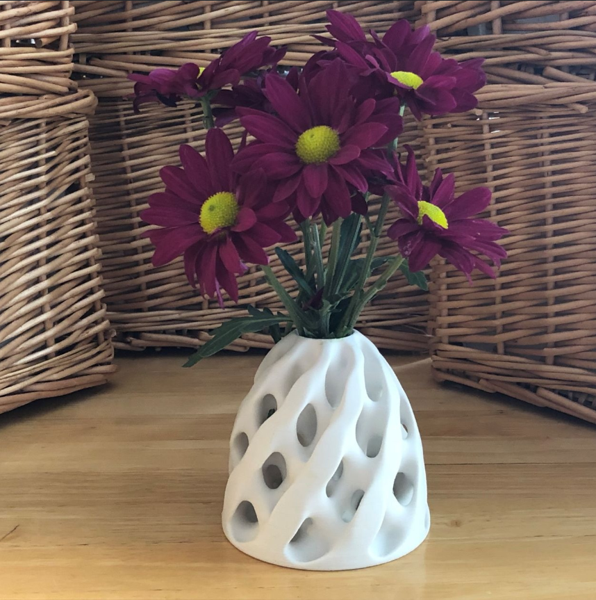 3D printed reticular forms 3D vase with unique pattern.