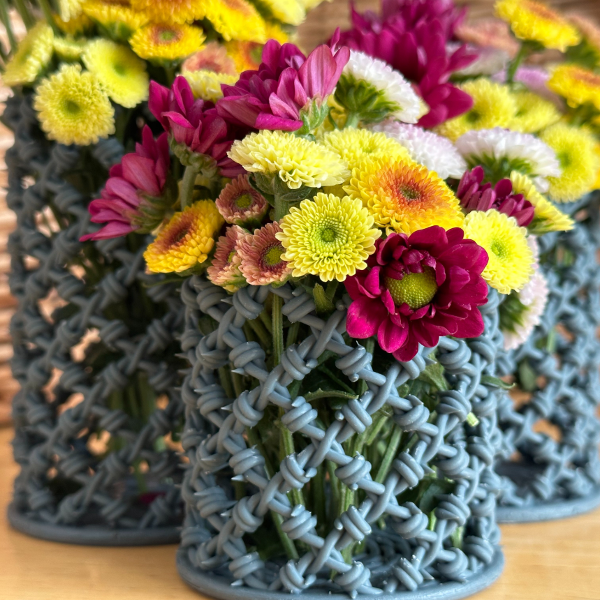 3D Printed vases with barbed wire design.