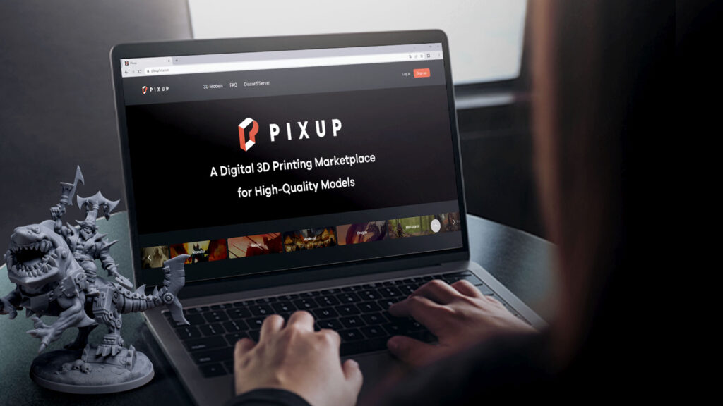 A picture of a laptop with PIXUP3D on its screen and a miniature placed left of it. 